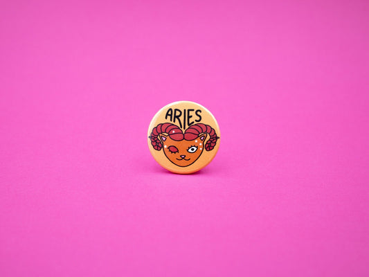 aries cat badge in orange and red colours and the text &#39;aries&#39;