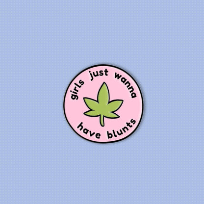 circular pink soft enamel pin with green weed leaf and the words &#39;girls just wanna have blunts&#39;
